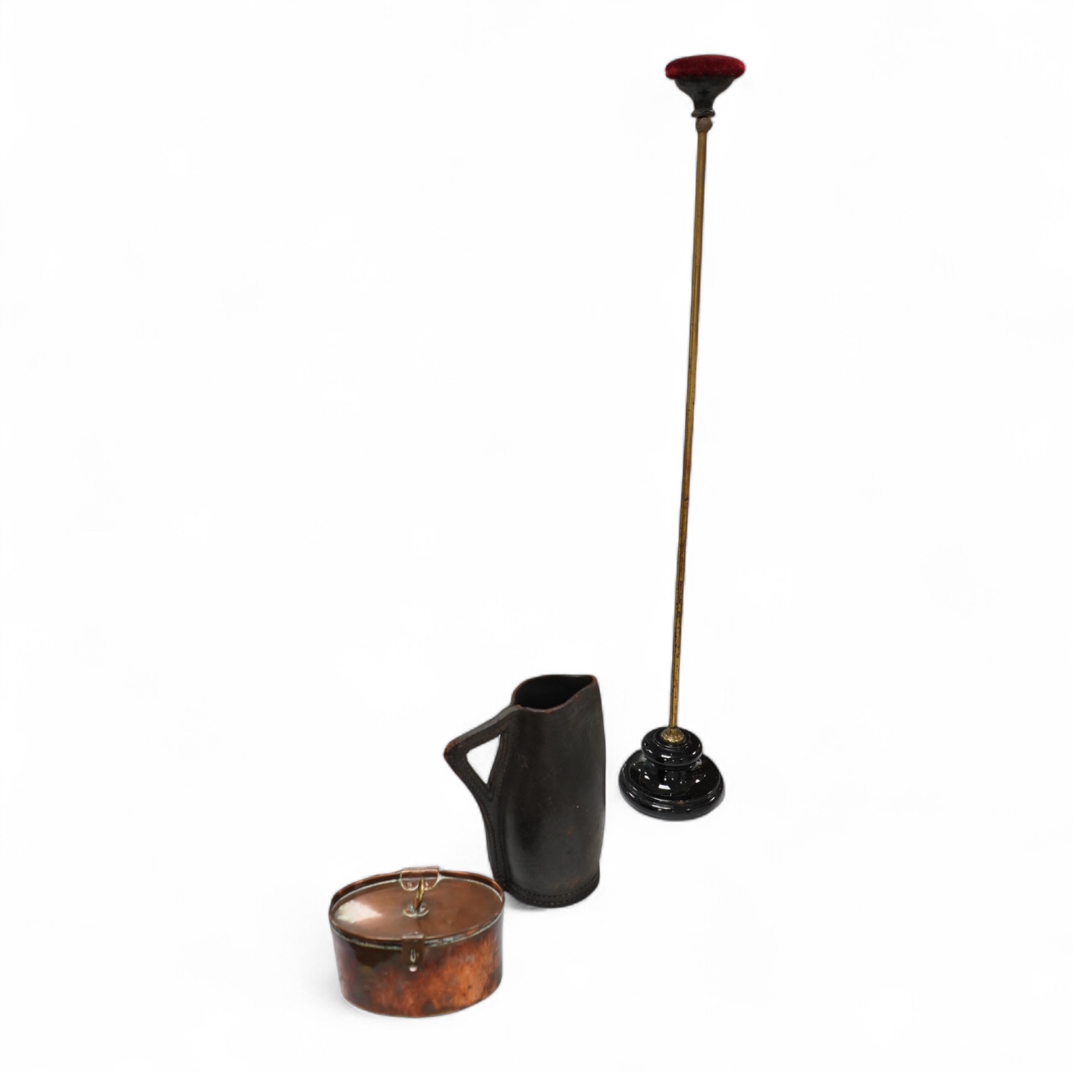 An adjustable wig stand, an oval copper box and a leather black jack jug, 24cm high.